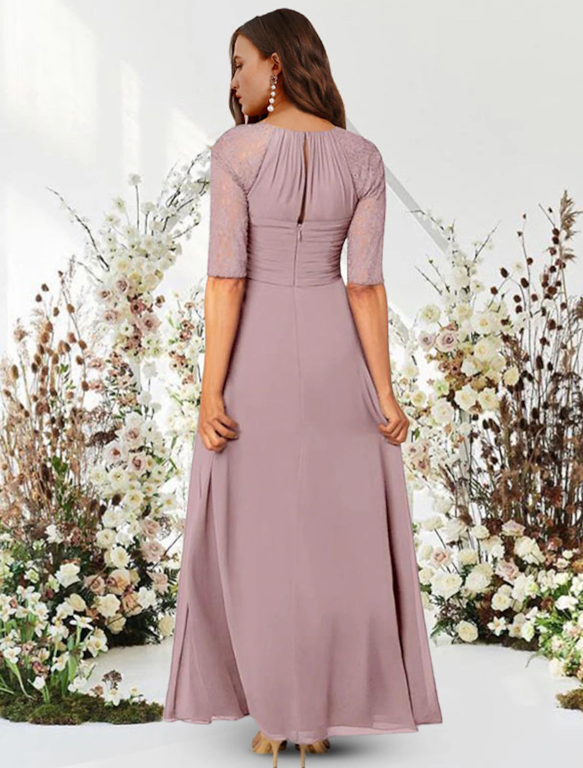 Side view of the navy A-line chiffon gown, highlighting pleated and ruched details.