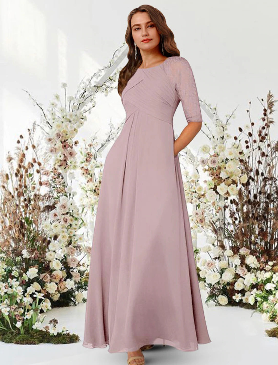 Close-up of the jewel neck and half sleeve on the navy chiffon gown.