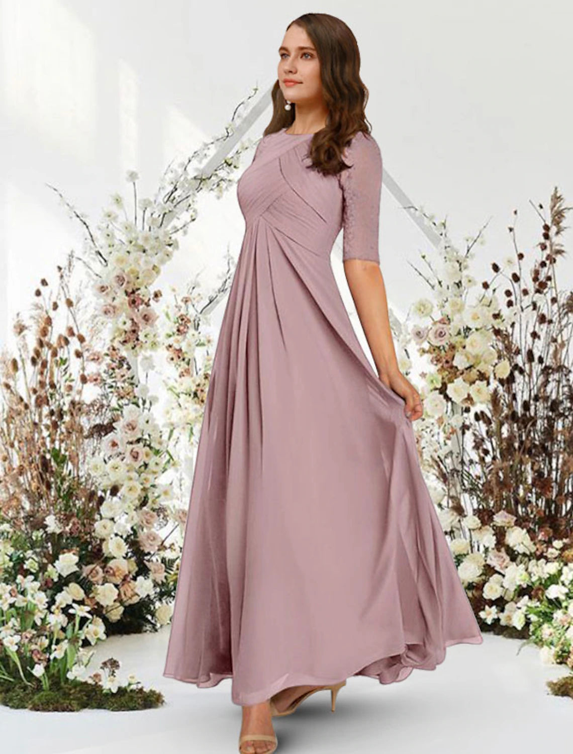 Full view of a woman showcasing the elegant drape of the navy A-line chiffon gown.