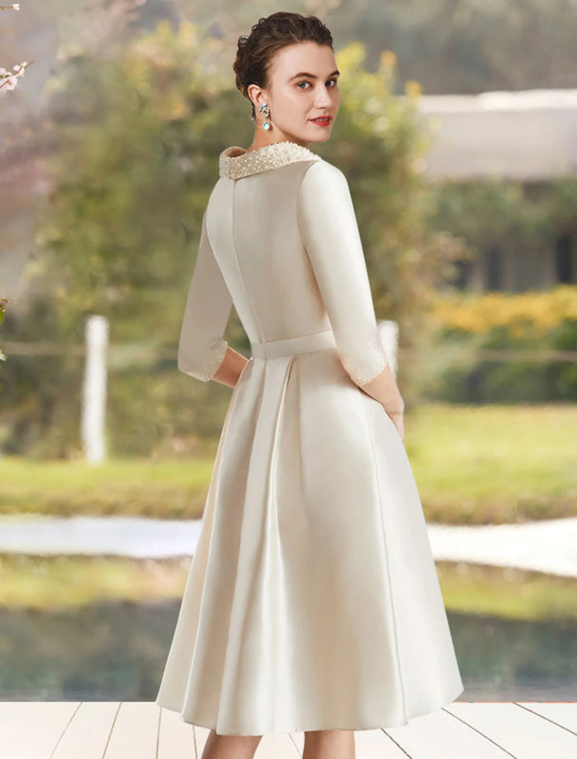 Side view of the Weitese A-line knee-length dress, showcasing the satin fabric and beaded details.
