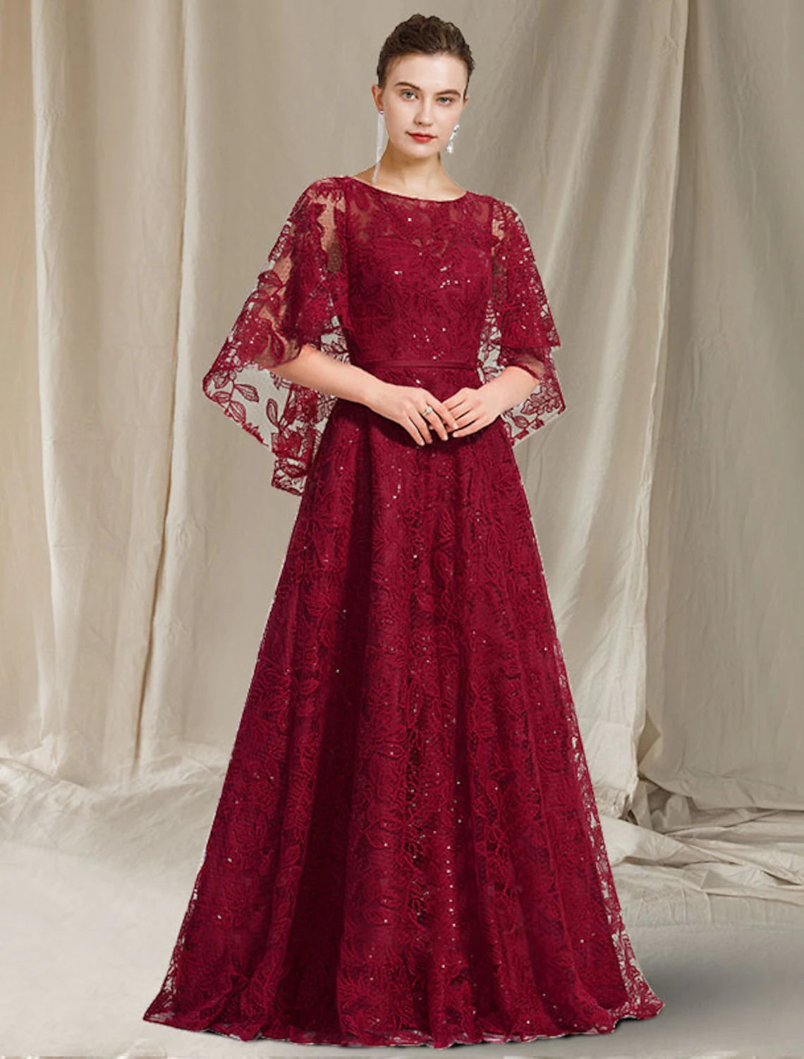 Elegant A-Line Mother of the Bride Gown with jewel neck and lace sequin appliques.
