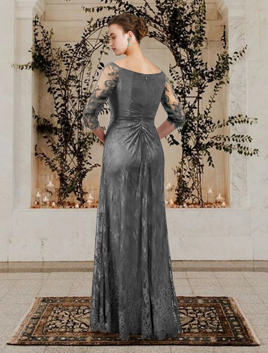Model posing in the elegant floor-length Mother of the Bride dress.