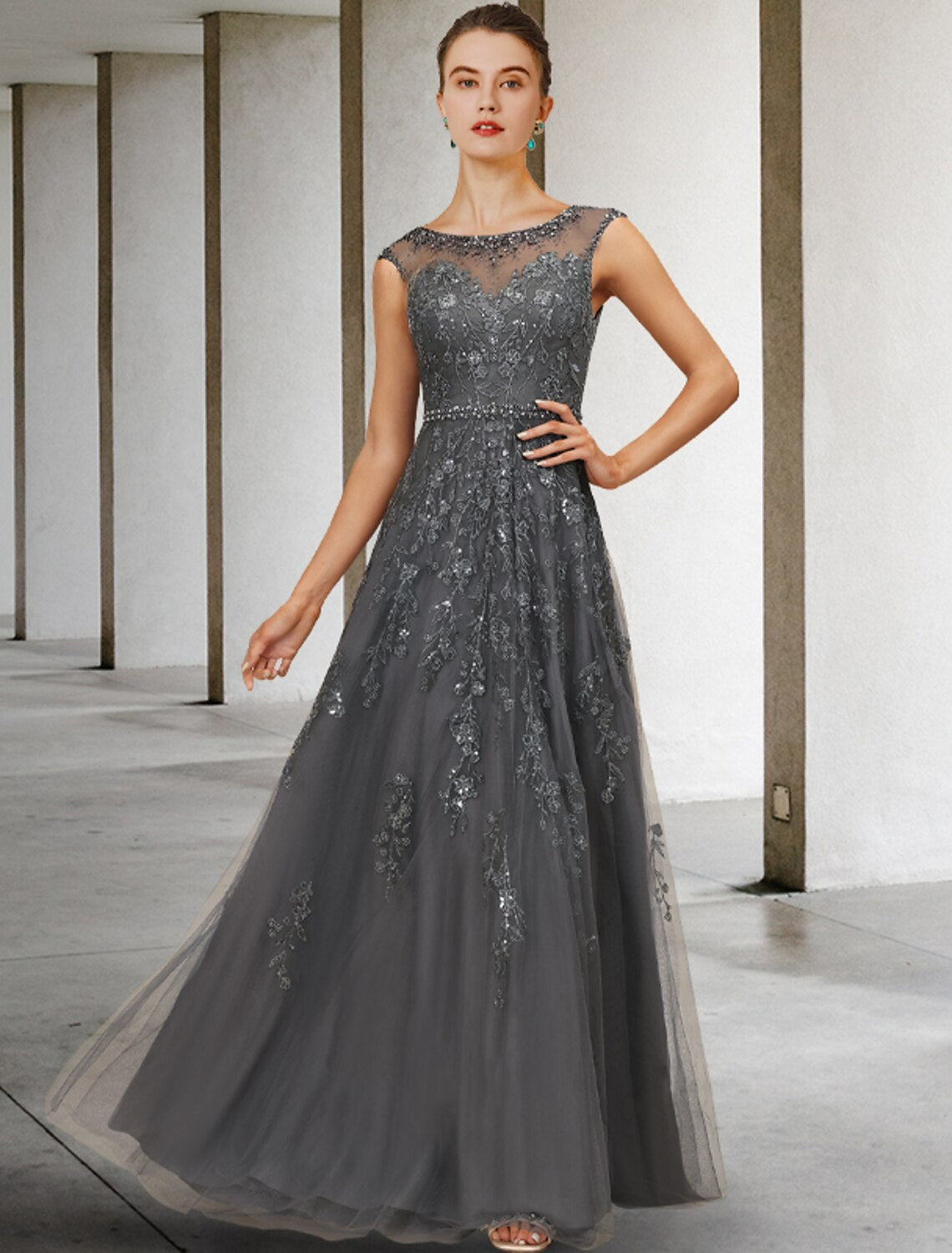Elegant A-Line Mother of the Bride dress with jewel neck, lace, tulle, beading, and a sash.
