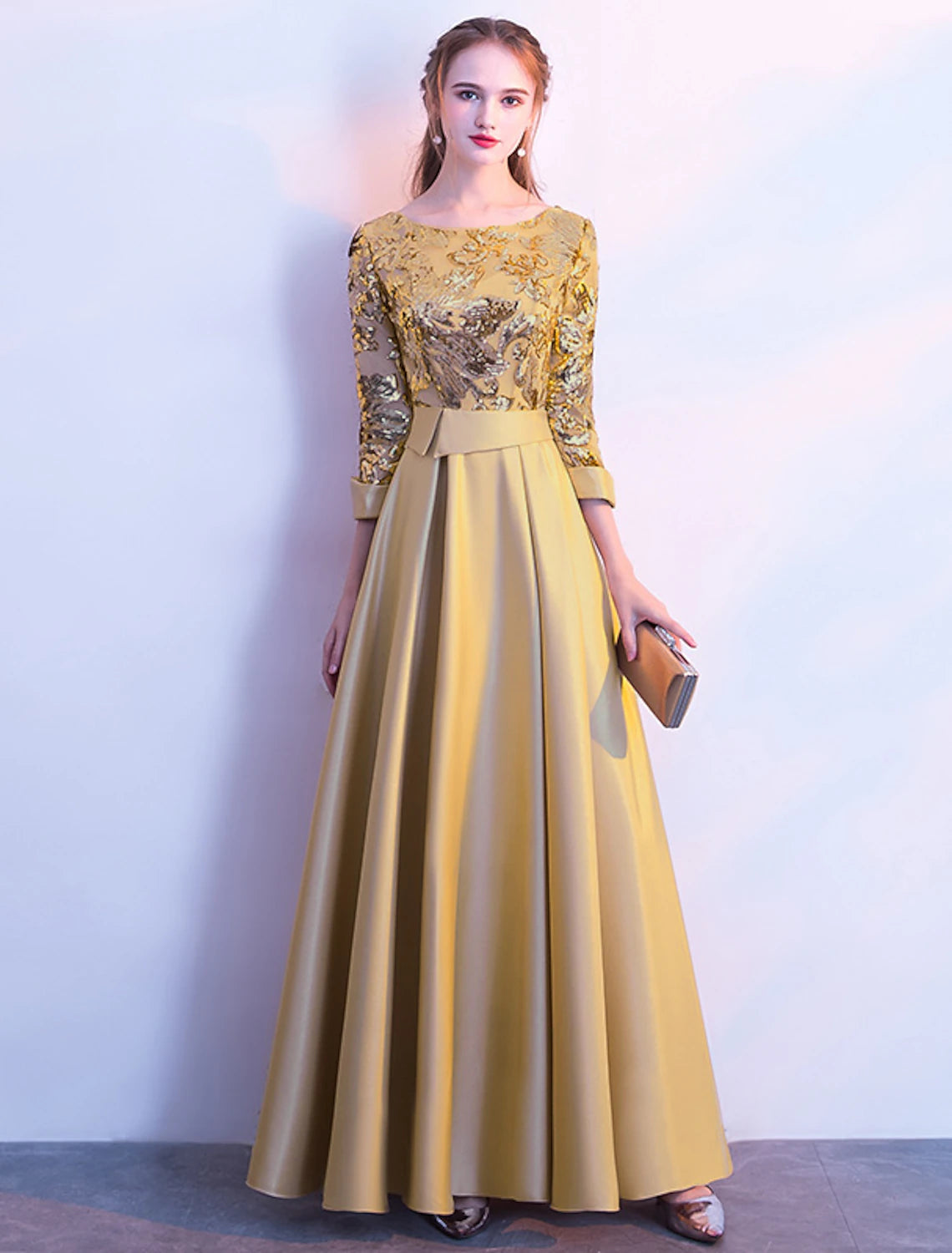 Model wearing a floor-length A-line bridesmaid dress with jewel neck and long sleeves.
