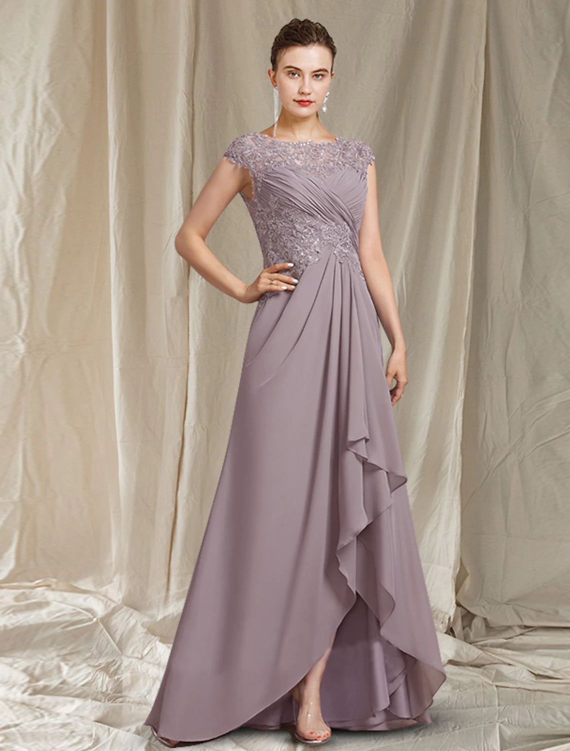 Elegant A-line mother of the bride dress with jewel neck and short sleeves, featuring a high-low hem and sequin appliques.