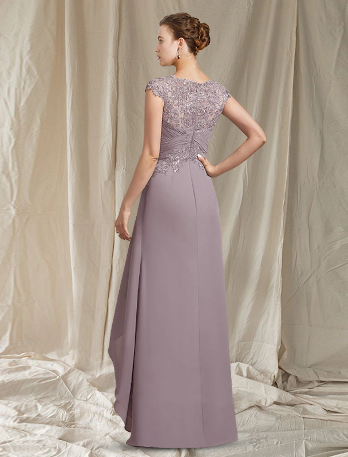 Close-up of the chiffon lace and sequin appliques on the Weitese mother of the bride dress.