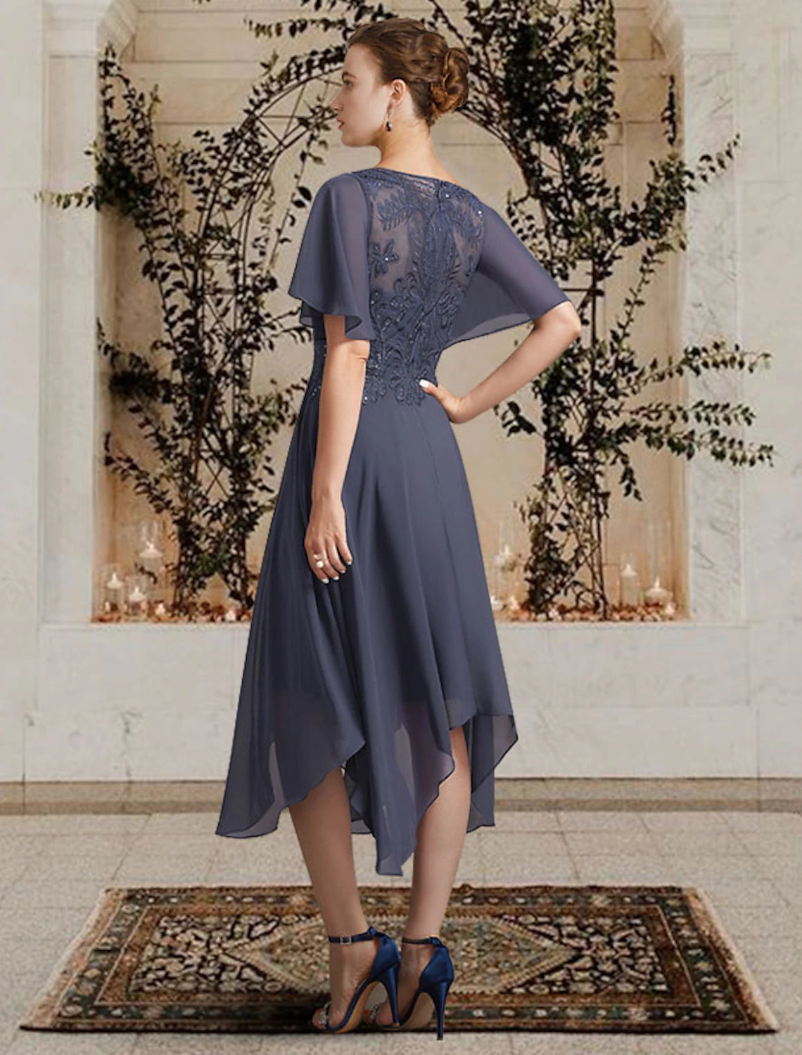 Back view of the A-line chiffon lace dress, showing high-low hem and appliques.