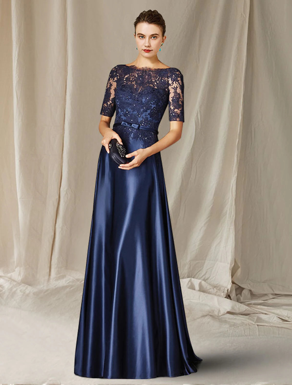 Elegant A-Line Mother of the Bride dress with jewel neck and short sleeves.