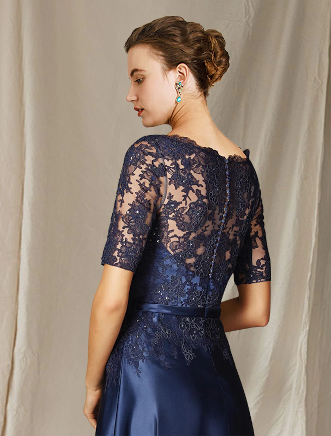 A-Line Mother of the Bride dress with lace and bow appliques.