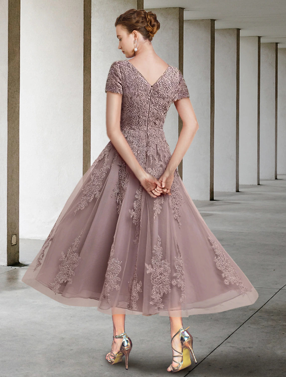 Back view of the tea length A-Line dress showing lace tulle and appliques.
