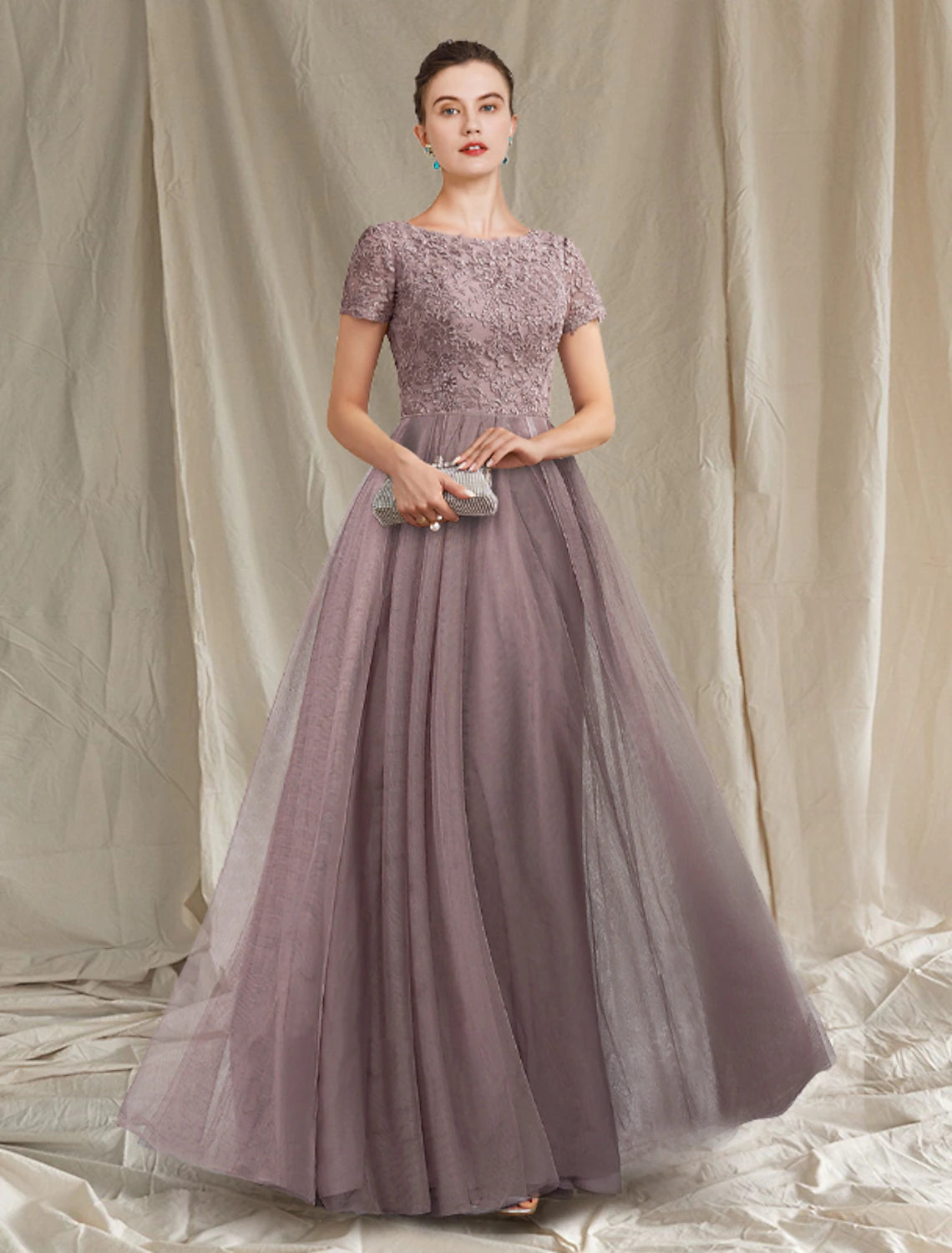 Elegant A-Line Mother of the Bride dress with jewel neck and short sleeves.