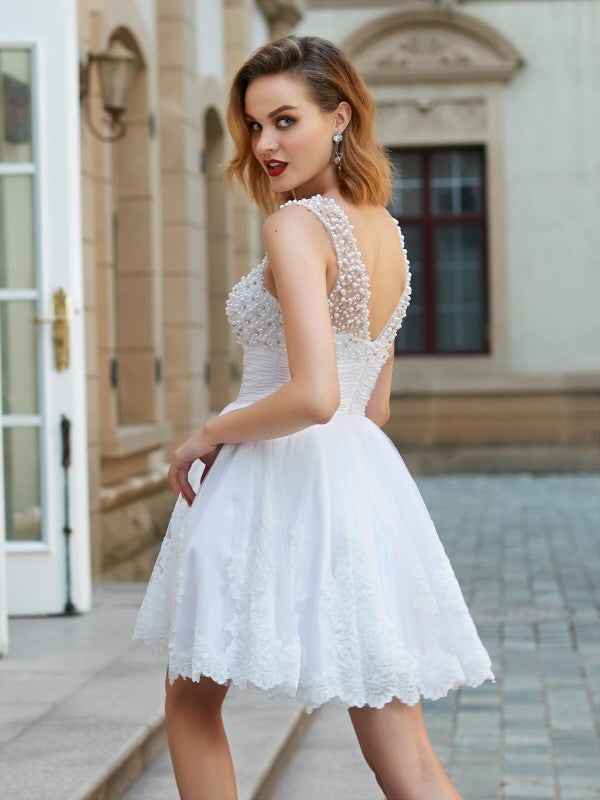 Woman posing gracefully in the Weitese A-line mini cocktail dress.