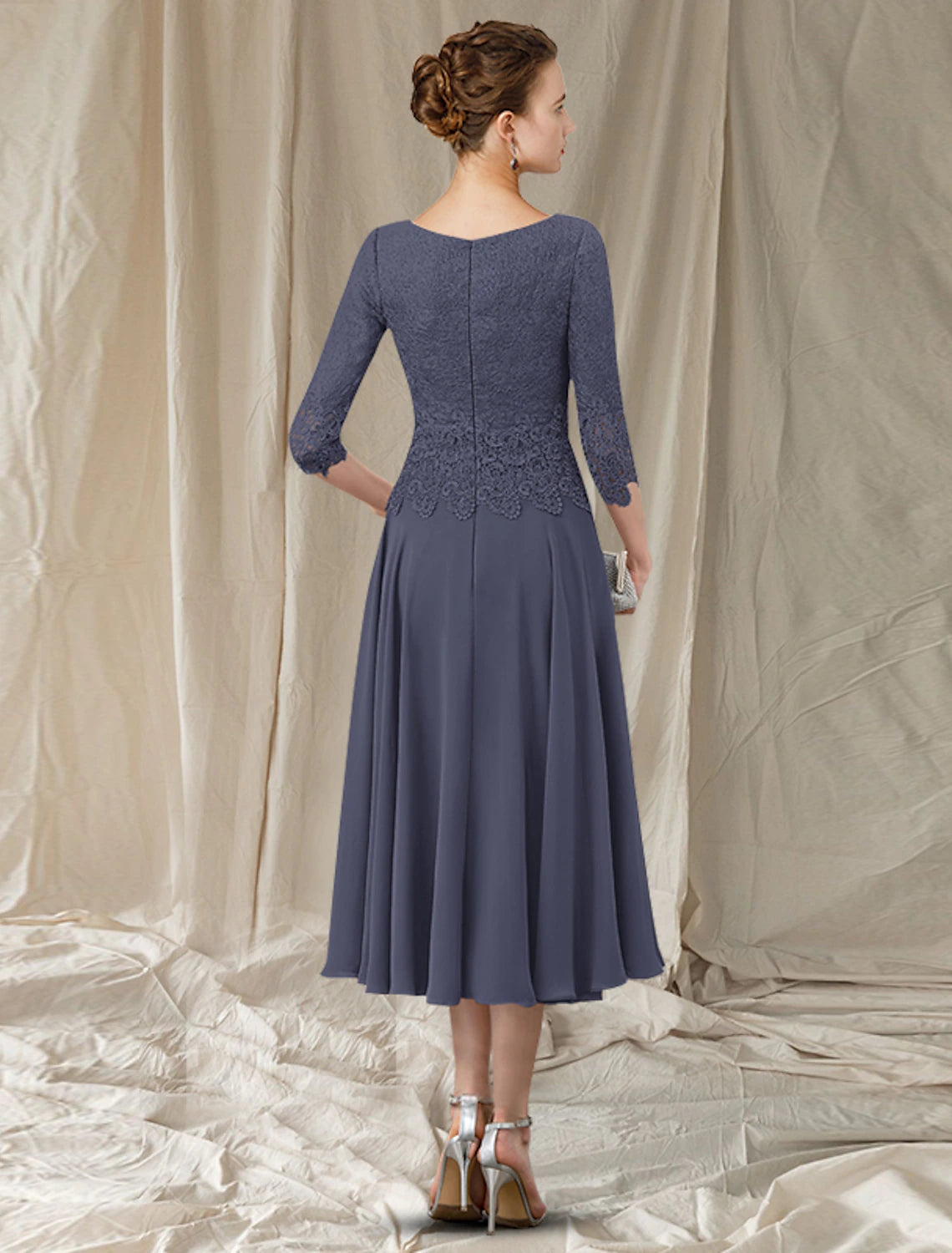 Side view of the A-Line Mother of the Bride dress, highlighting 3/4 lace sleeves and pleated chiffon.