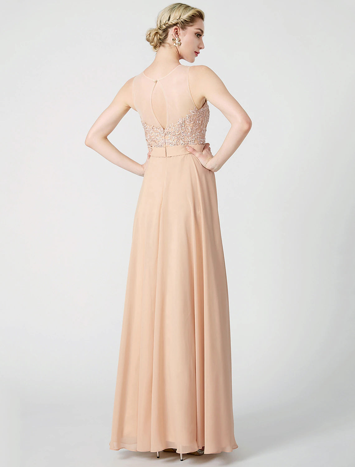 Close-up of the keyhole illusion neckline and intricate beaded lace on the dress.
