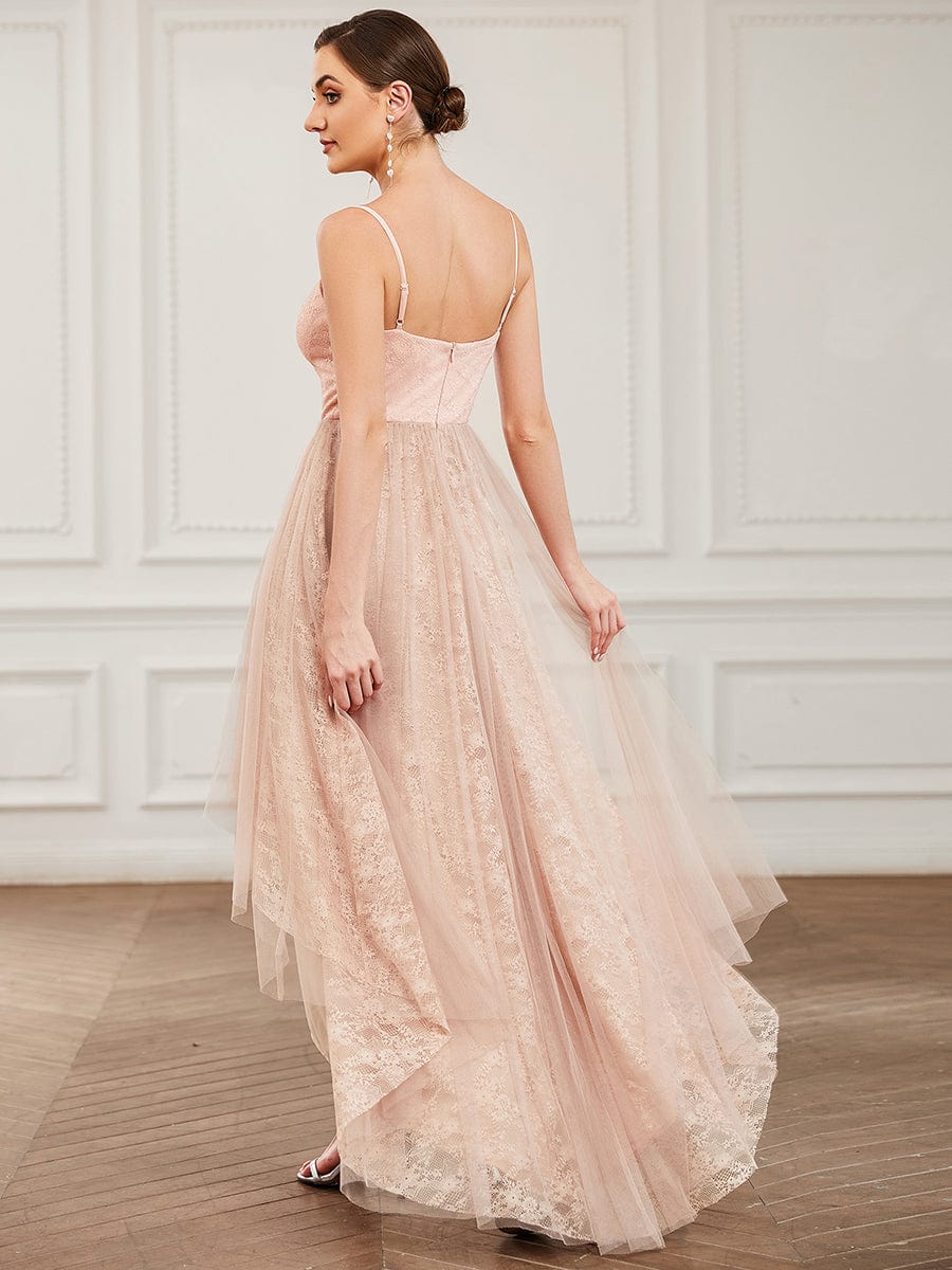 Side view of a model in a burgundy Weitese A-Line high-low bridesmaid dress, showcasing the flowing tulle and hem.