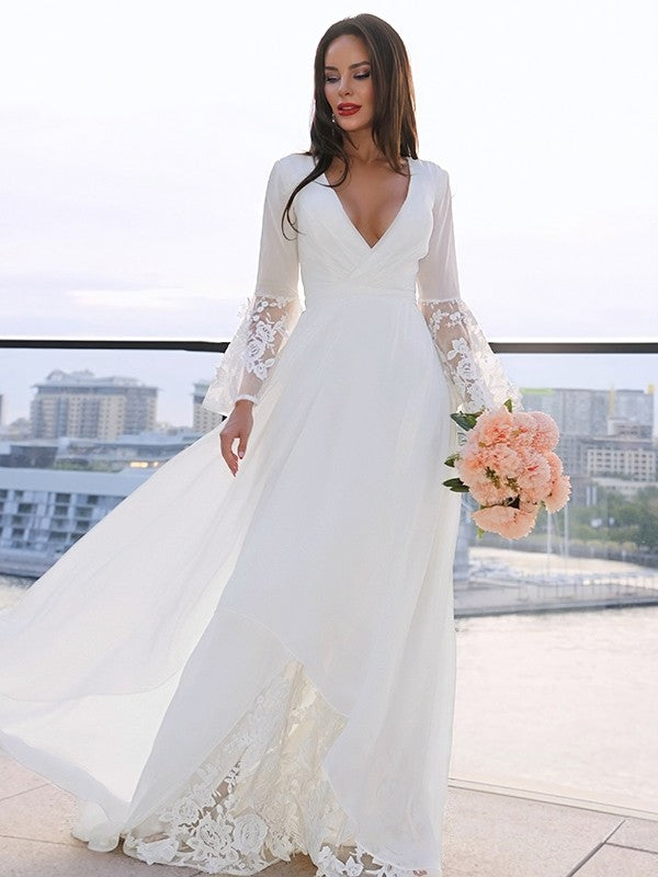Model wearing a Weitese A-Line lace V-neck long sleeve wedding dress with a sash.