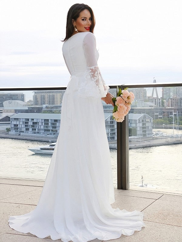 Back view of a model in a Weitese A-Line lace V-neck long sleeve wedding dress.