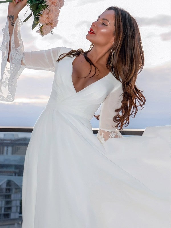 Full view of a Weitese A-Line lace V-neck long sleeve wedding dress with a sweep train.