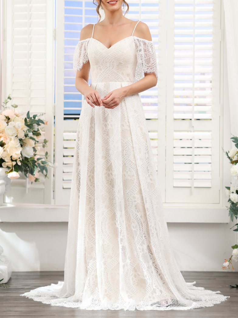Side profile of the bride wearing the long A-line wedding dress.