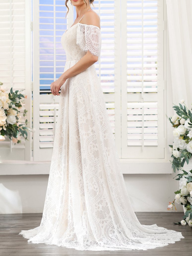 Close-up of the lace bodice and short sleeves on the wedding gown.
