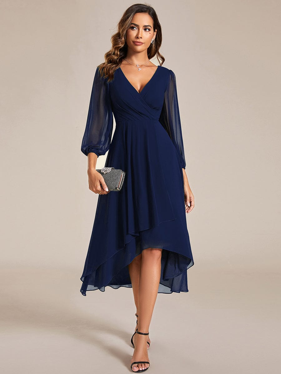 Model wearing a navy Weitese A-line long sleeve asymmetrical midi dress.
