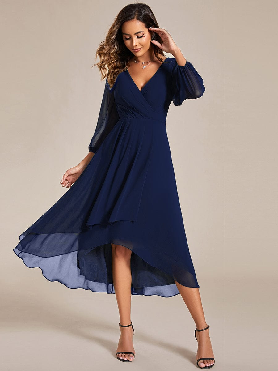 Close-up of the asymmetrical hem on a navy Weitese midi dress.
