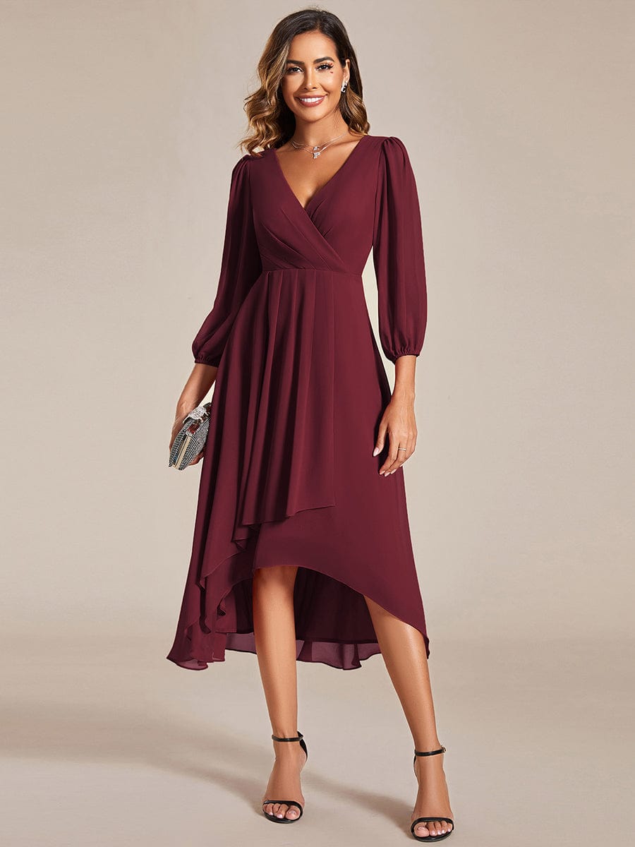 Model wearing a burgundy Weitese A-line long sleeve asymmetrical midi dress.