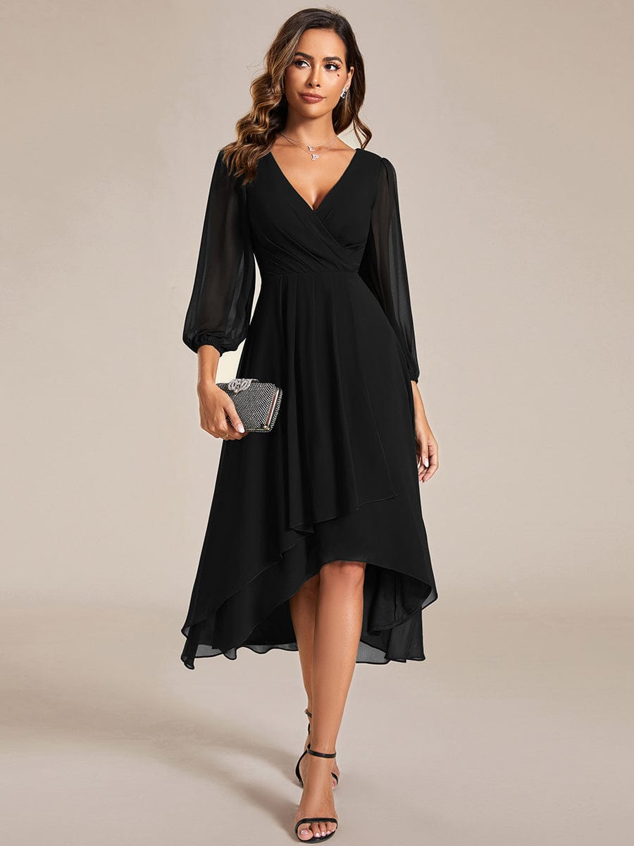 Model wearing a black Weitese A-line long sleeve asymmetrical midi dress.
