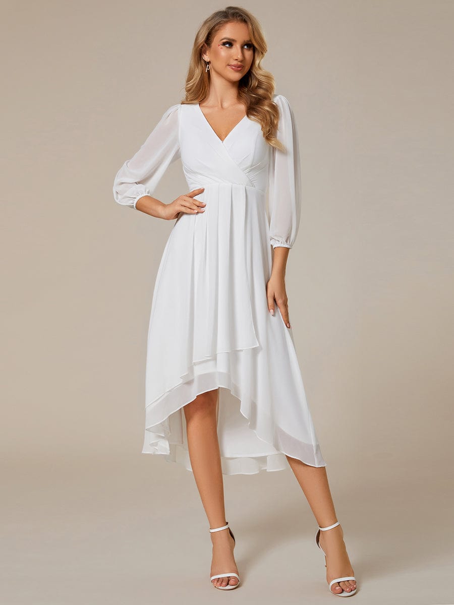 Model wearing a white Weitese A-line long sleeve asymmetrical midi dress.