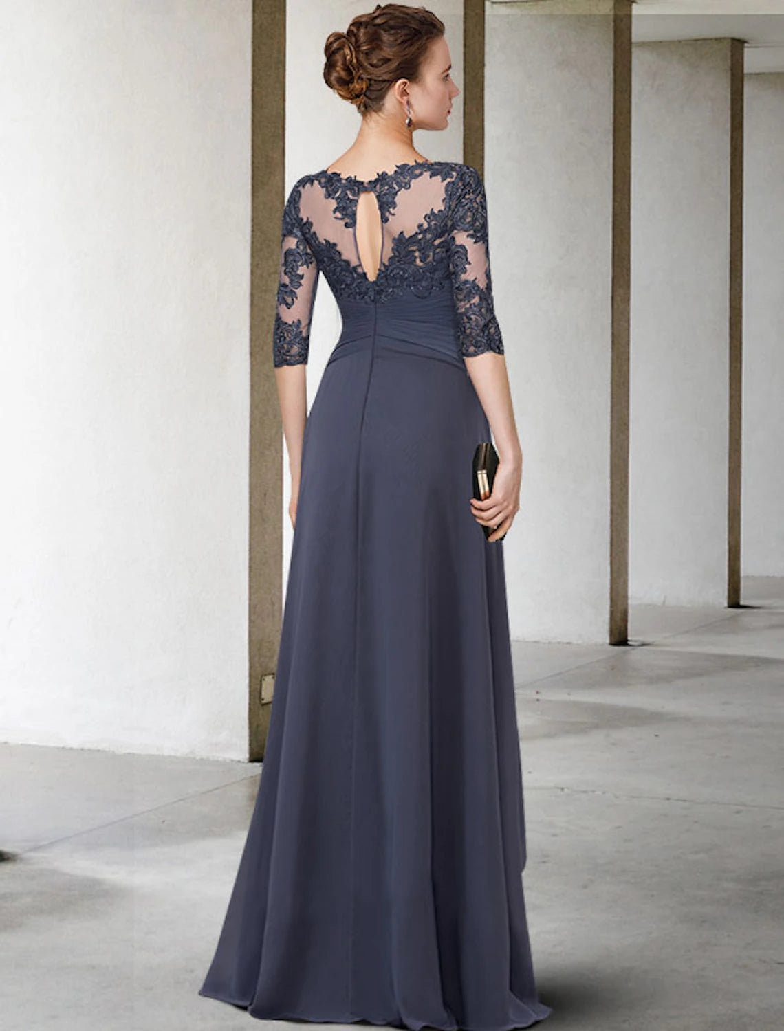 Close-up of the chiffon lace, pleats, and ruched appliques on the elegant dress.