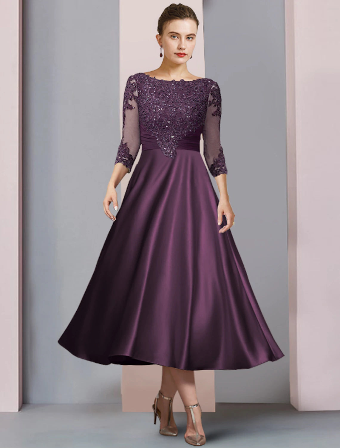Elegant A-line tea length mother of the bride dress with scoop neck, half sleeves, and sequin lace details.