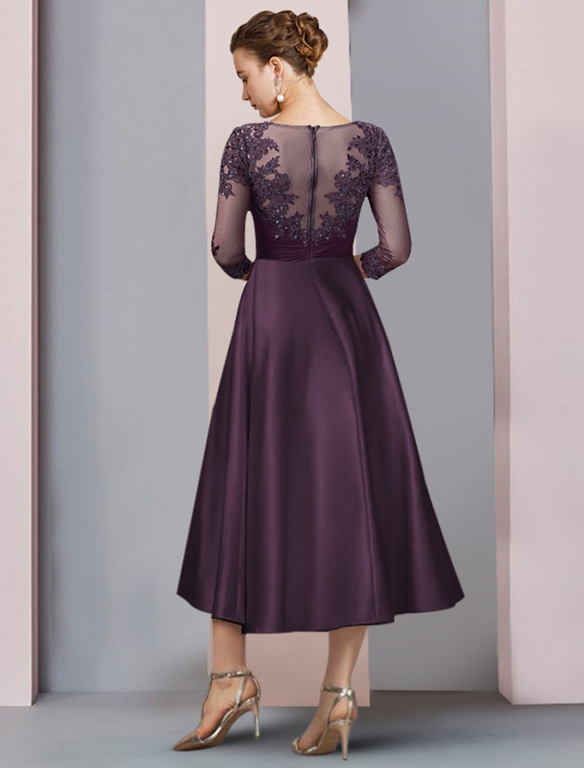 Back view of the elegant A-line tea length dress, showcasing the satin fabric and delicate lace appliques.