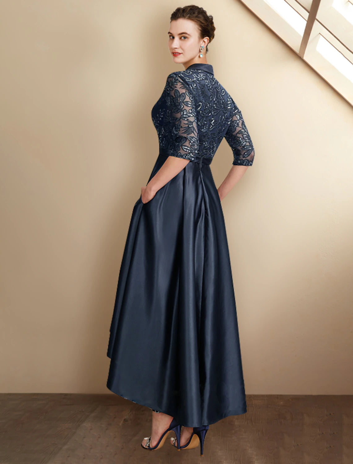 Side view of the A-Line Mother of the Bride dress, highlighting the high-low hem and pleats.