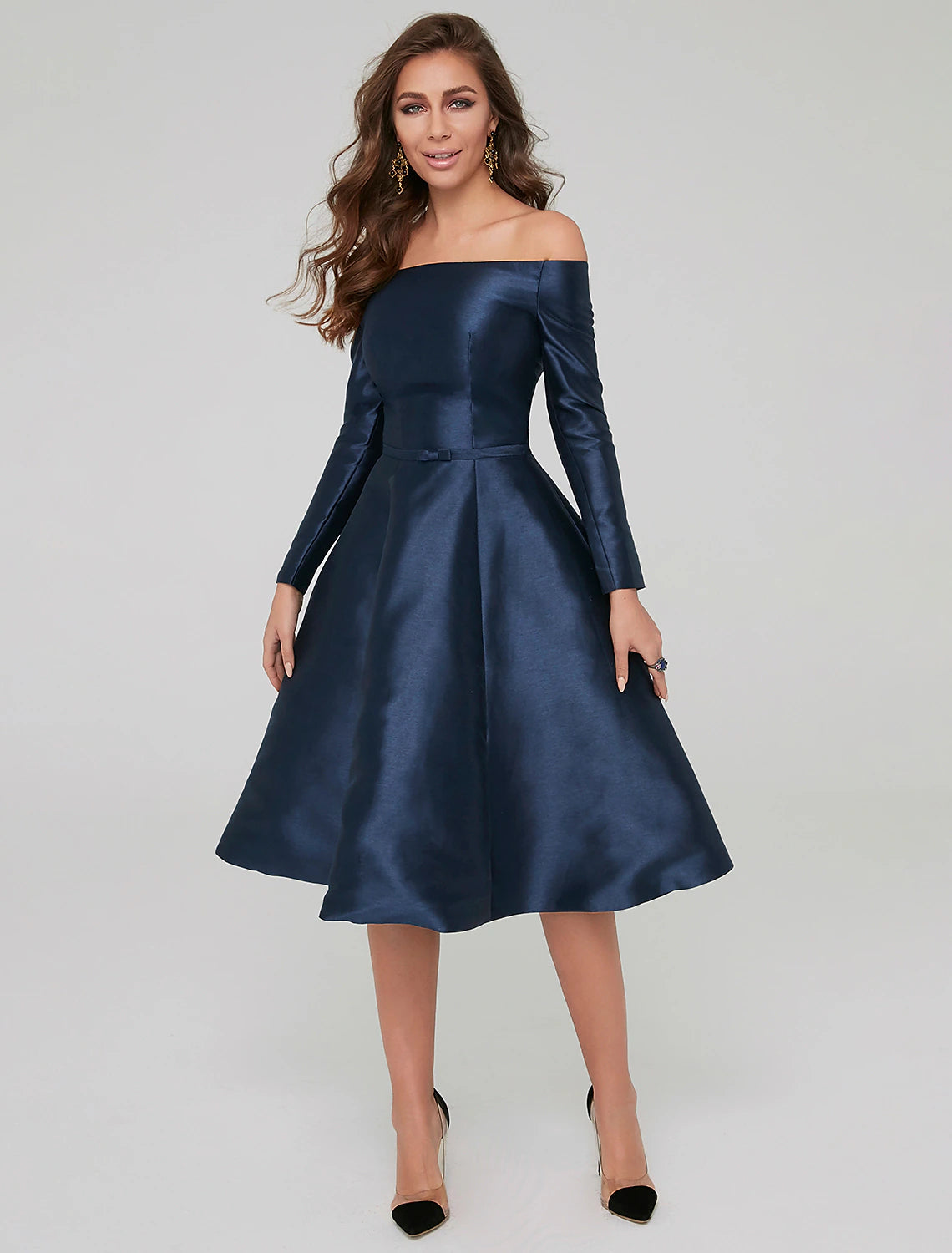 Woman in an elegant A-line off-shoulder long-sleeve satin dress.