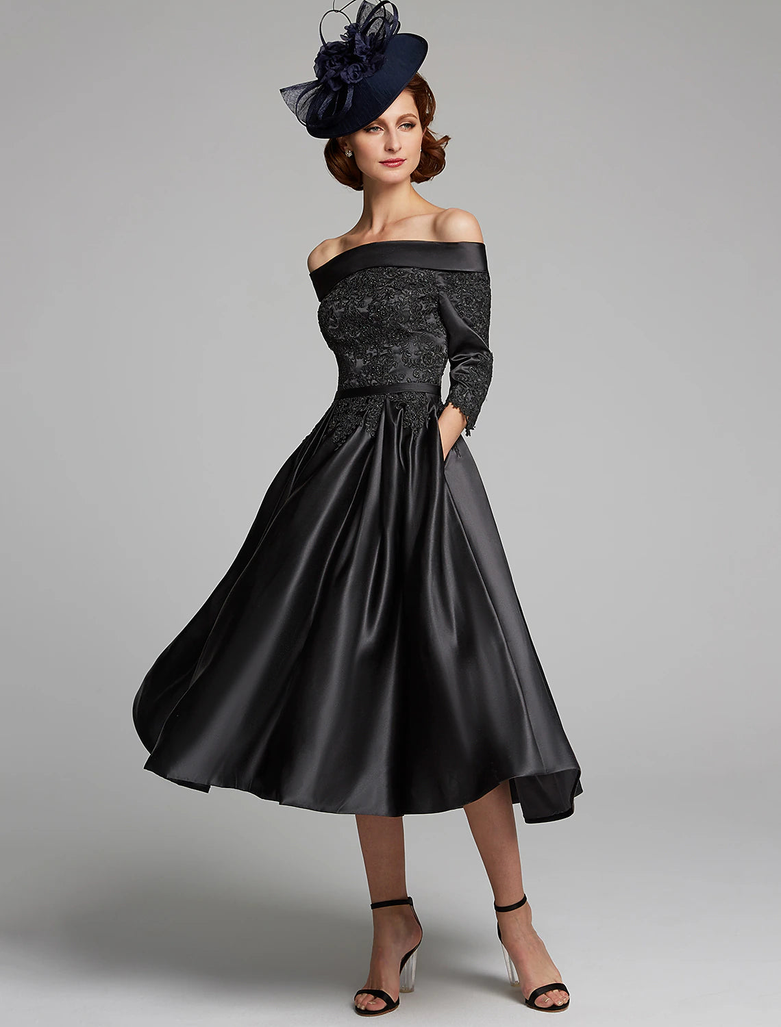 Weitese A-line off-shoulder tea length dress with lace details and 3/4 sleeves.
