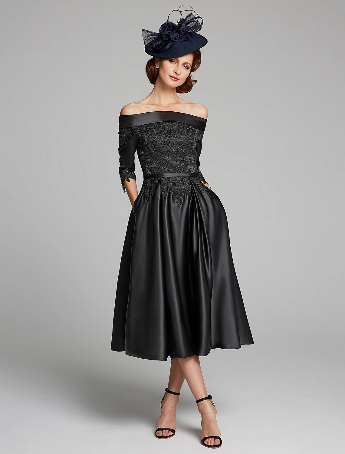 Side profile of the elegant off-shoulder satin lace dress.