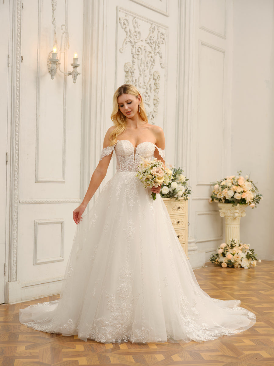 Close-up of delicate appliques on the bodice of the wedding dress.