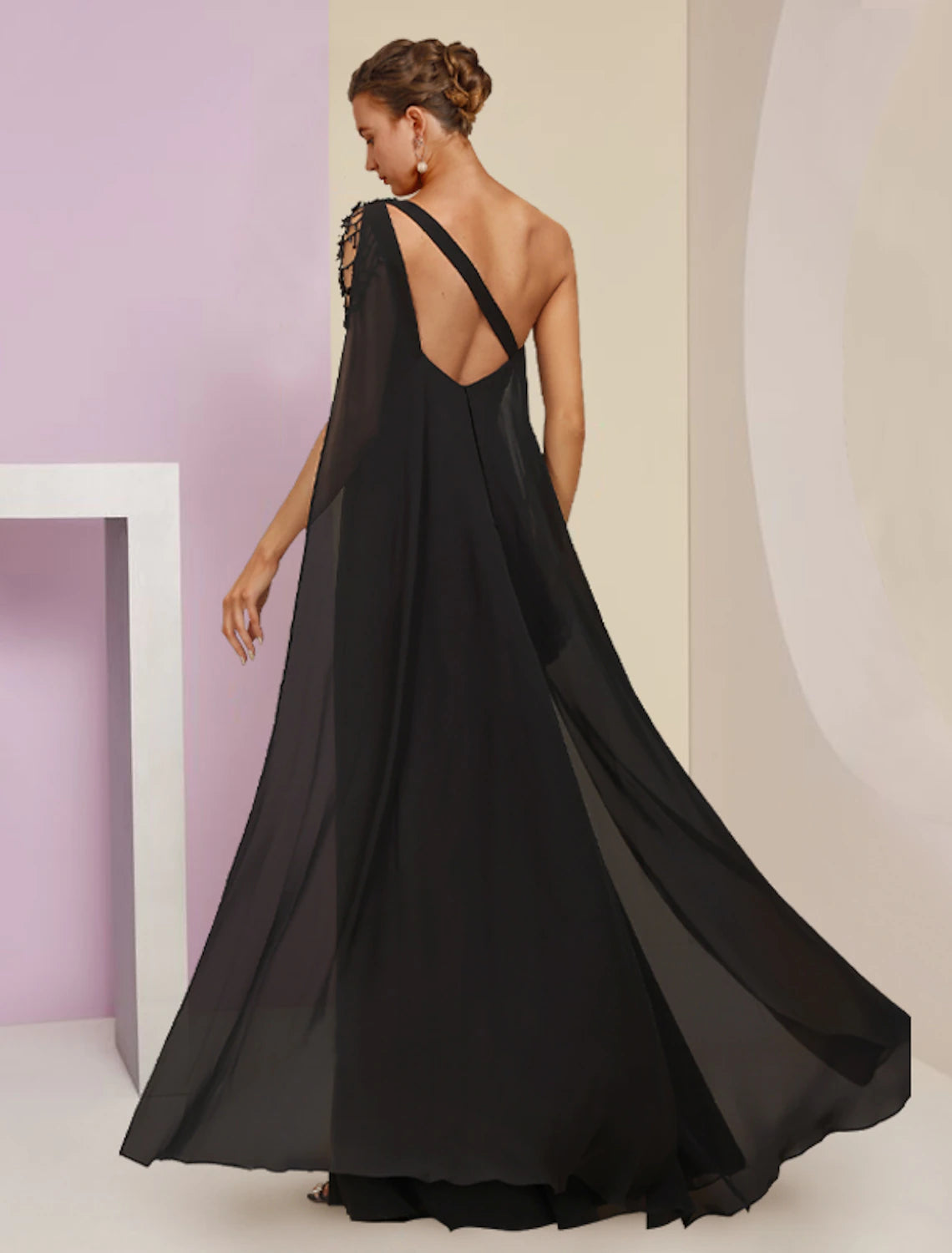 Front view of the A-line one-shoulder dress with delicate beading.