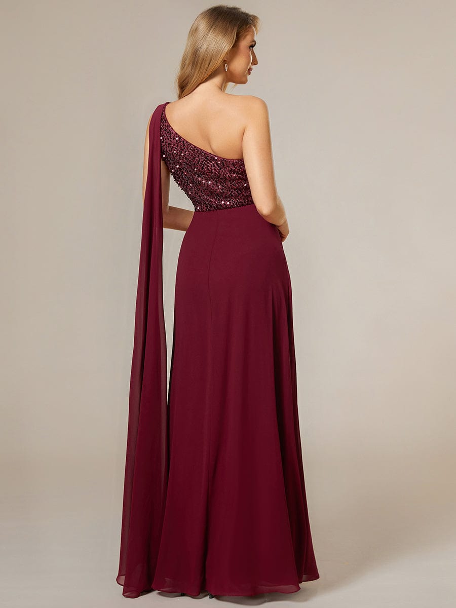 Side view of a model in a red one-shoulder sequin A-line chiffon dress.