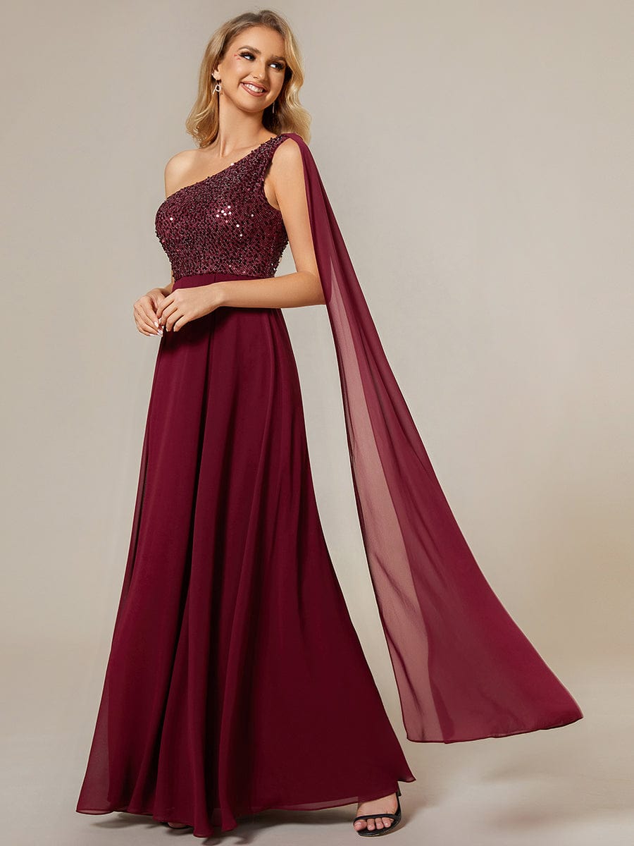 Back view of a red one-shoulder A-line chiffon evening dress with sequin detail.