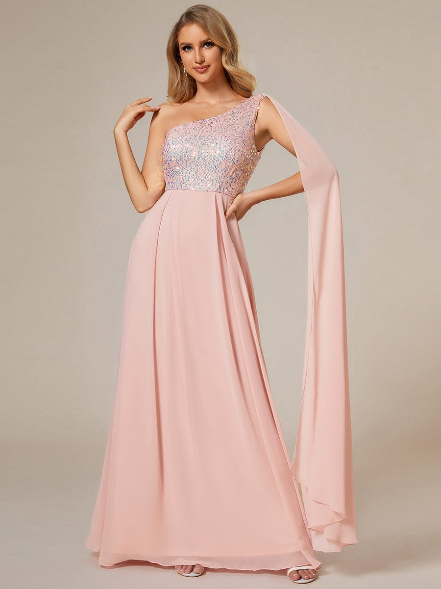 Model wearing a pink one-shoulder A-line evening dress with a sequin bodice.