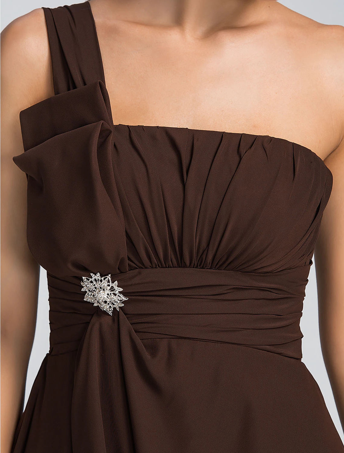 Side view of the model wearing the A-line one-shoulder dress.