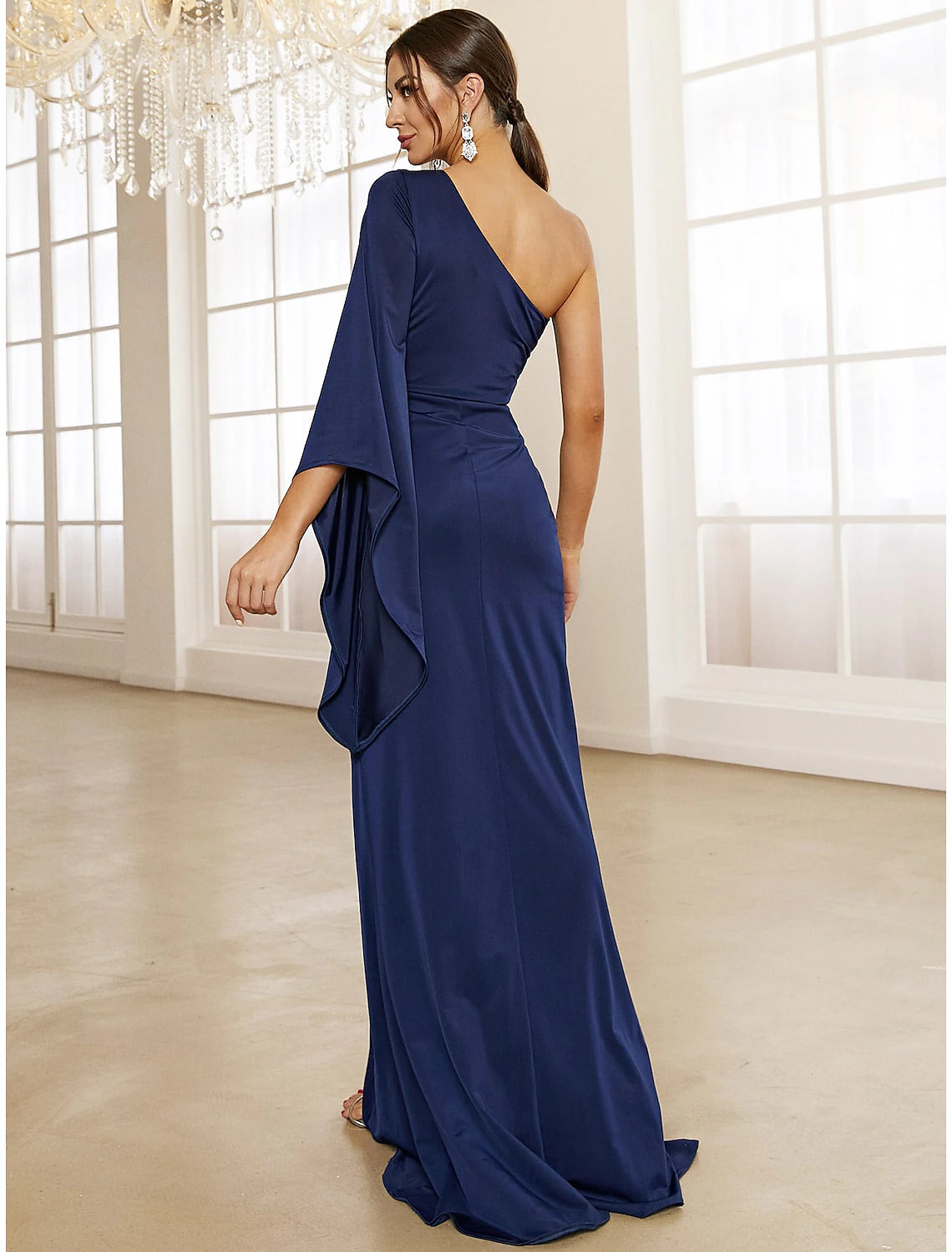 Side view of the elegant Weitese evening gown, highlighting the one-shoulder design and sweep train.