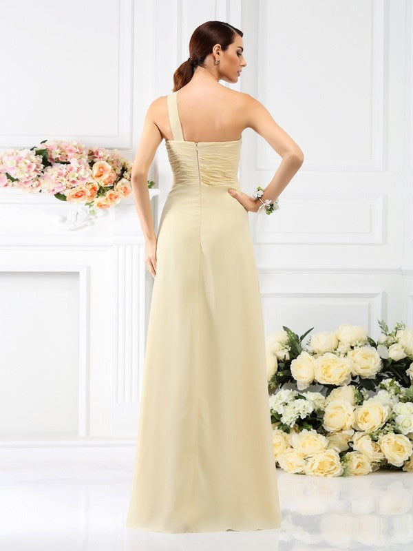 Side view of a model in an A-line one-shoulder pleated chiffon long bridesmaid dress.