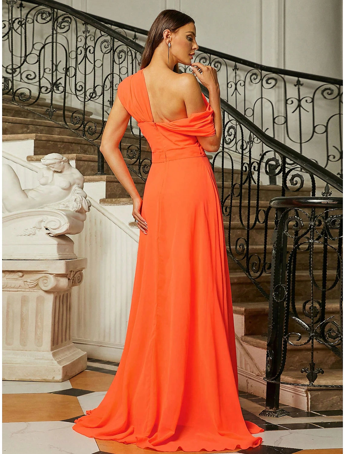 Side view of the one-shoulder A-line evening gown, showcasing the silhouette and ruched details.