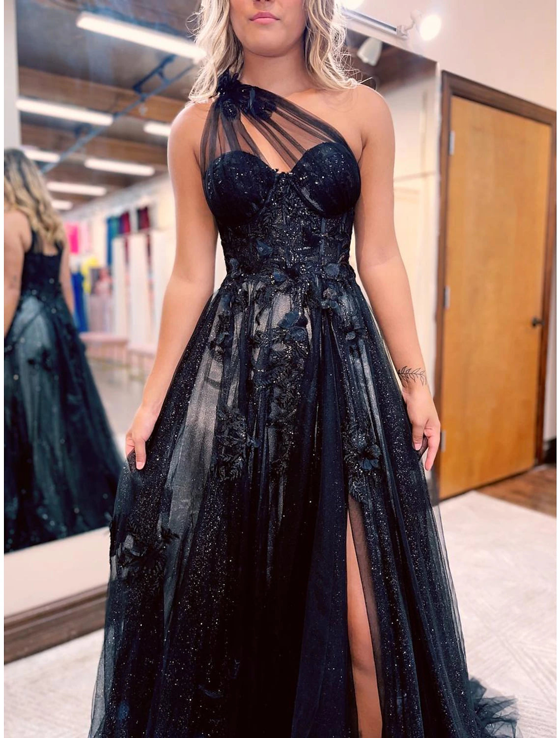 Close-up of the Weitese A-Line prom dress showing the one-shoulder detail, appliques, and pleats.