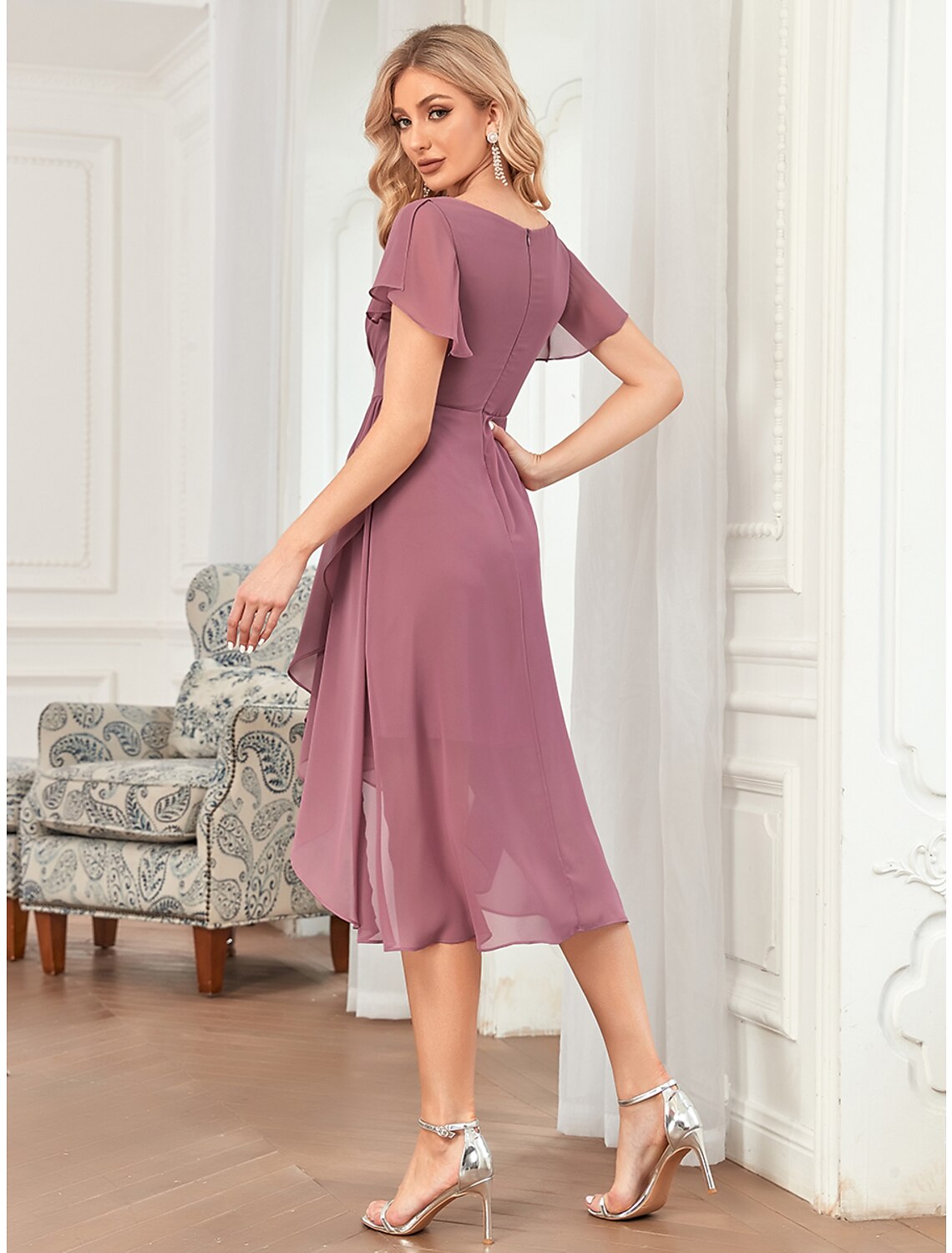 Side view of the A-line short chiffon dress, showing asymmetrical hem and ruffles.