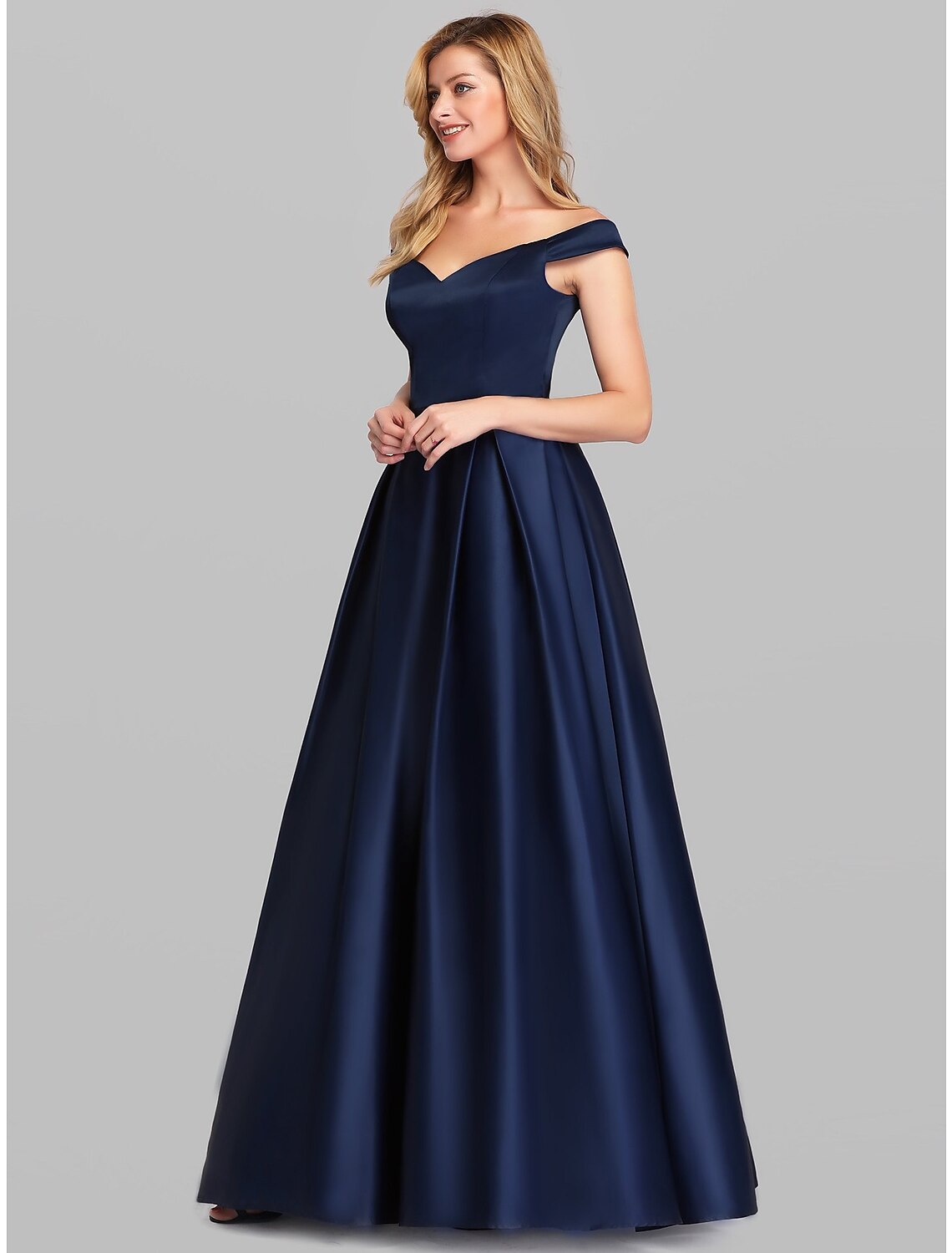 Close-up of the luxurious satin fabric and ruched detail on the evening gown.