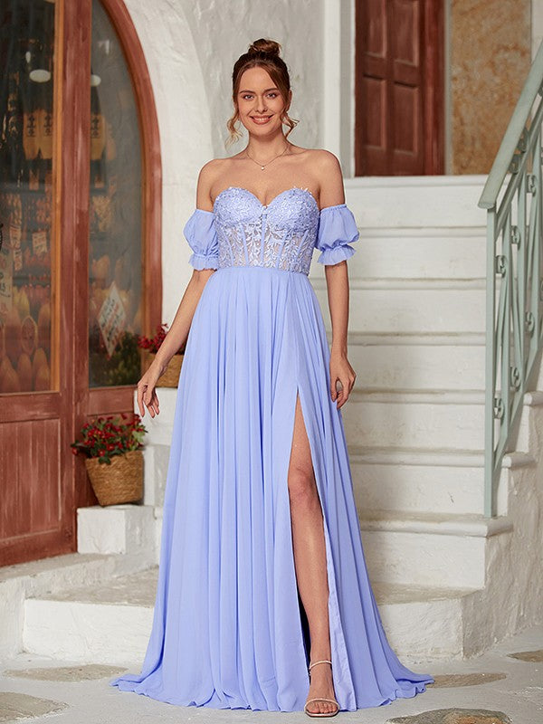 Model wearing an elegant A-line princess chiffon lace prom dress with short sleeves and a sweetheart neckline.