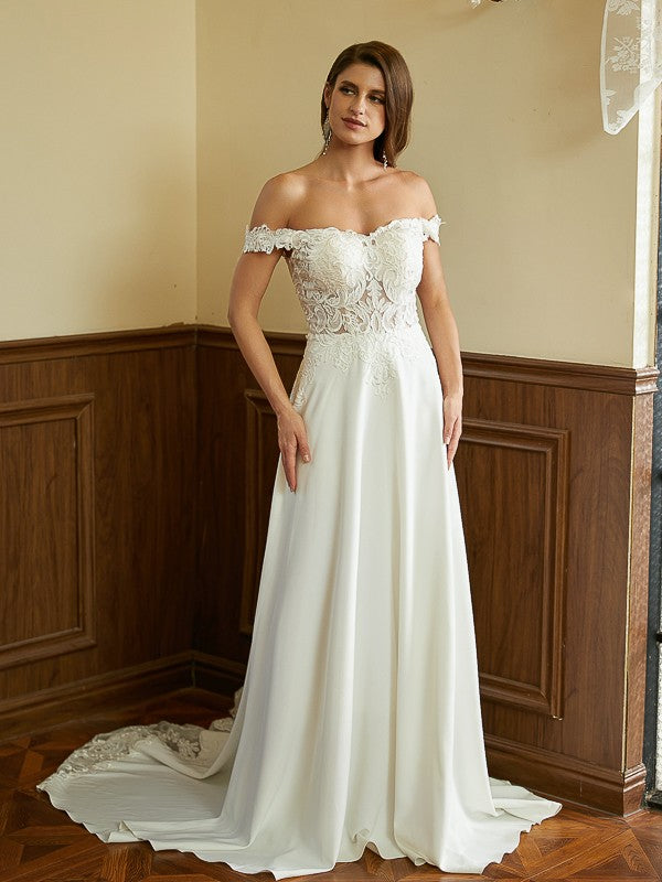 Close-up of the Weitese wedding dress bodice, highlighting off-shoulder neckline and lace sleeves.
